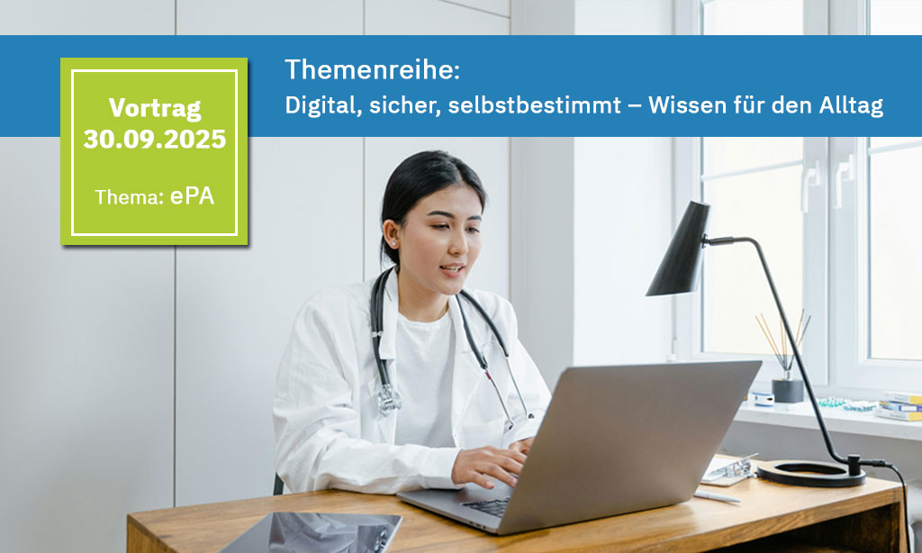 Junge Ärztin sitzt in Ihrer Praxis vor dem Laptop.